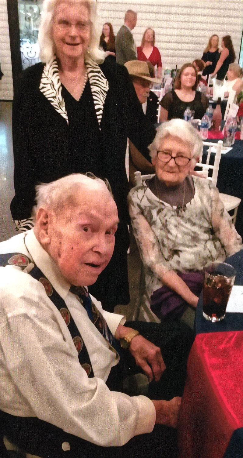 James Krodel, U.S. Marine who served at Iwo Jima during World War Two, and his wife, Mary, (seated) were guests at the annual Marine Corps ball Friday, Nov. 4 at Hidden Pines Venue in Mineola.